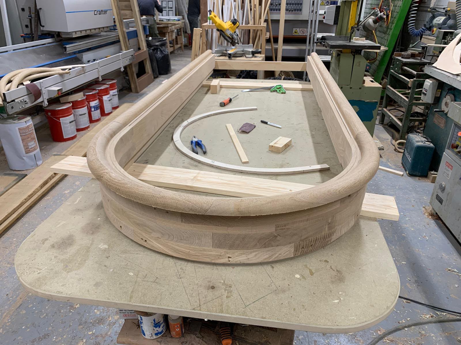 A hand-built curved bow window frame in solid oak