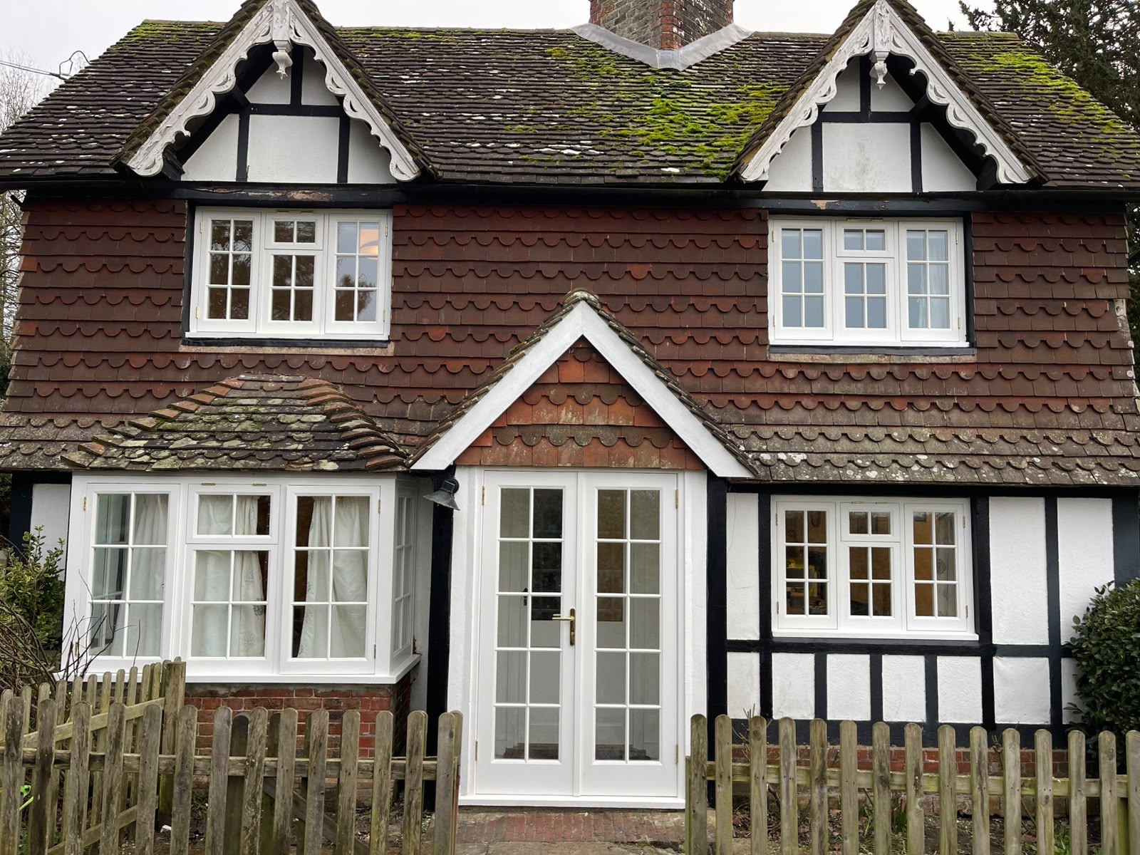 Sash windows and a French door, hand built by Wood Grain Joinery, installed on a period cottage